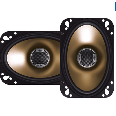 Pair of gold and black speakers on a white background