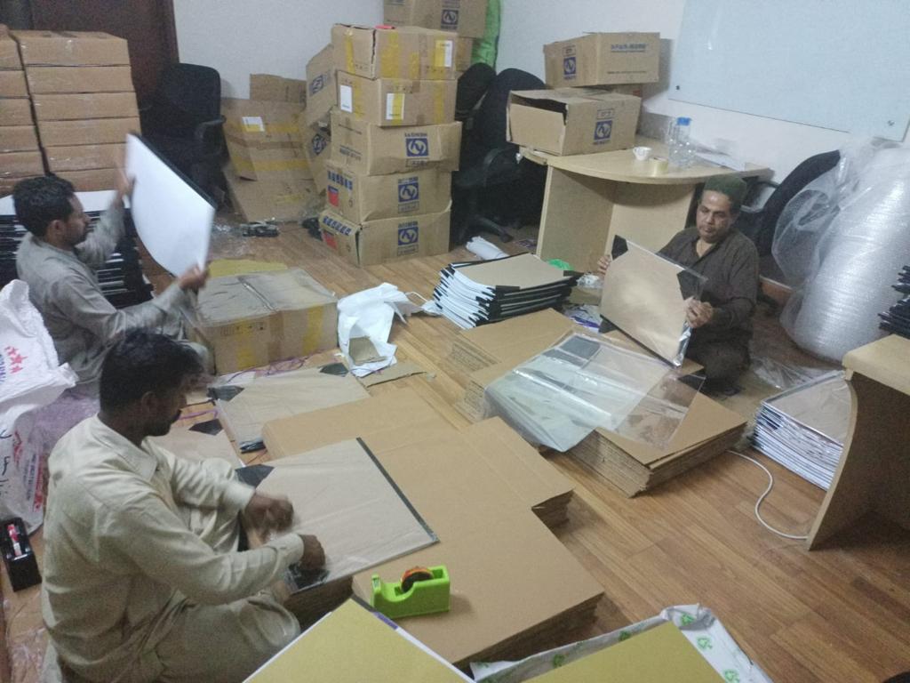AUKSales staff carefully packing a wholesale order